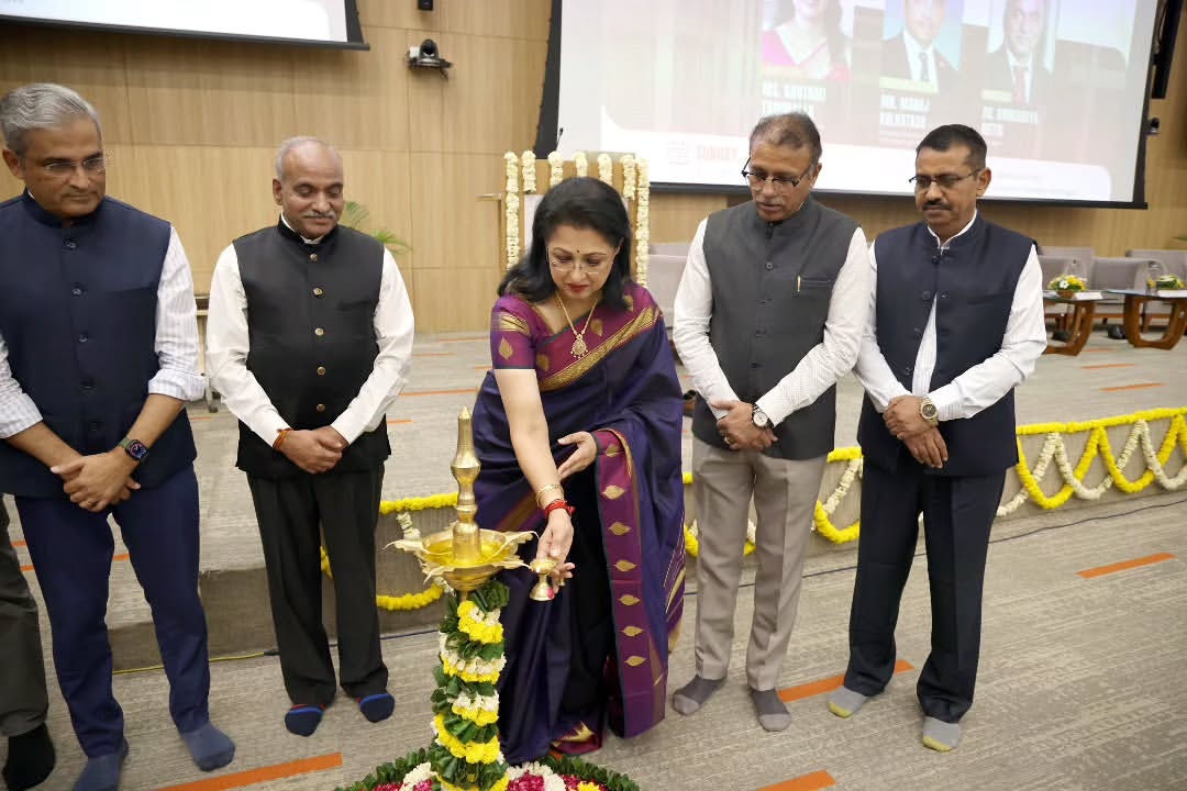 Gautami lighting traditional Kuthu Vilakku lamp at education summit